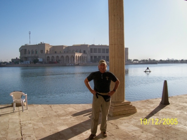 Major Messing stands on the lake side patio of one of Saddam Hussein's palaces.